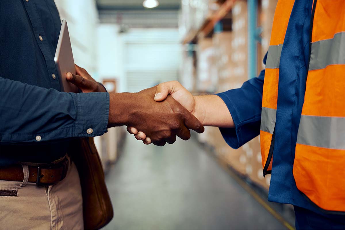 two engineers shaking hands